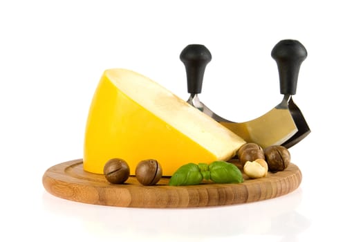 a kilogramm cheese, a cheese slicer and nuts