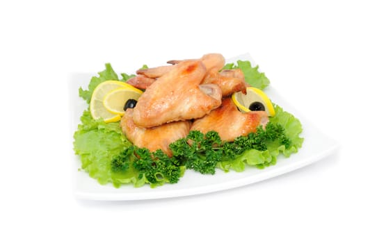 Fried chicken wings with tomato on white background

