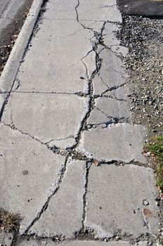 Cracked Sidewalk in Urban Area