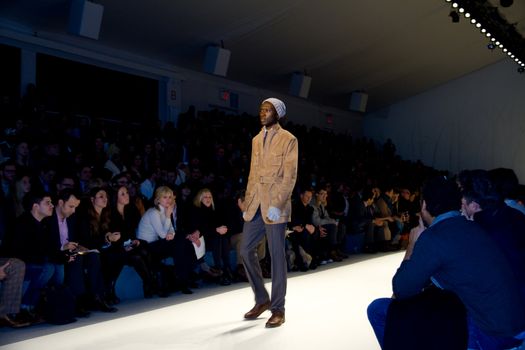 NEW YORK, NY - FEBRUARY 11: Models walk the runway at the Perry Ellis Fall 2011 fashion show during Mercedes-Benz Fashion Week at The Stage at Lincoln Center on February 11, 2011 in New York City.