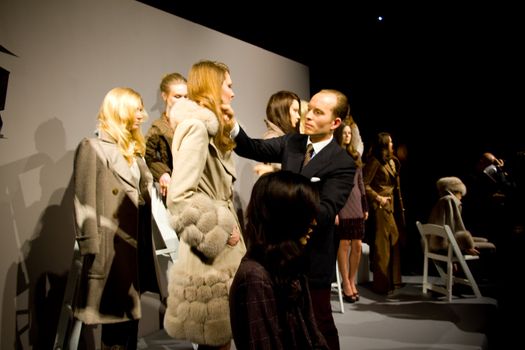 NEW YORK, NY - FEBRUARY 11: Designer Norman Ambrose onstage during his Fall 2011 presentation during Mercedes-Benz Fashion Week at The Box at Lincoln Center on February 11, 2011 in New York City.