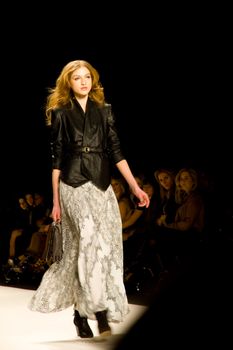 NEW YORK, NY - FEBRUARY 11: A model walks the runway at the Rebecca Minkoff Fall 2011 fashion show during Mercedes-Benz Fashion week at The Theatre at Lincoln Center on February 11, 2011 in New York City. (Photo by Diana Beato)