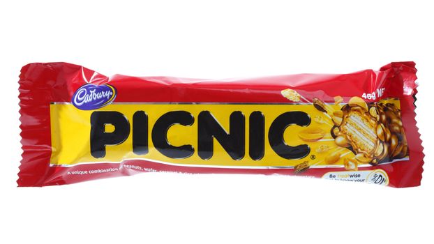 Cadbury Picnic chocolate bar snack 46g (1012kj)  a combination of peanuts, wafer, rice crisps, caramel covered in delicious milk chocolate.  White Background.  Editorial use only.