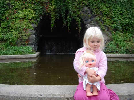 little girl with her doll