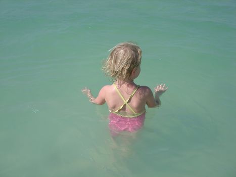 little girl swimming in the sea