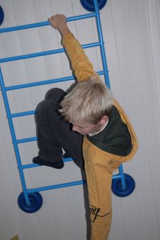 boy climbing the ladder