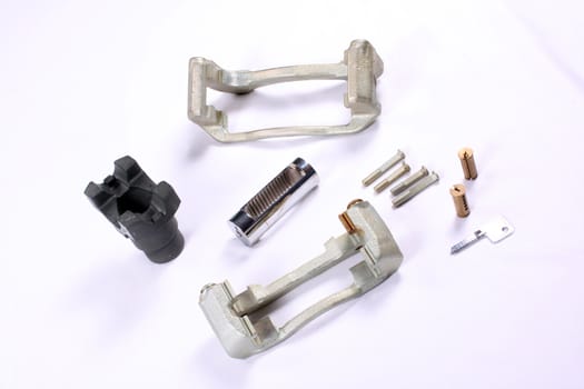 Various industrial products including automobile parts and internal parts of a lock and key.