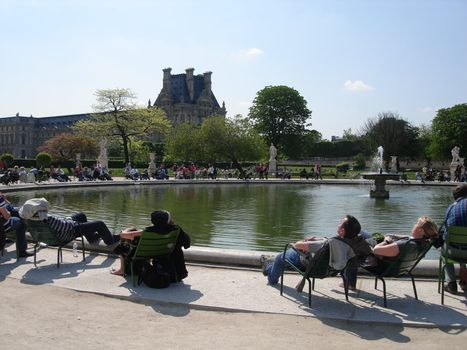 people sitting around the fountain