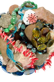Close up of many different colorful natural gems: agate onyx, coral