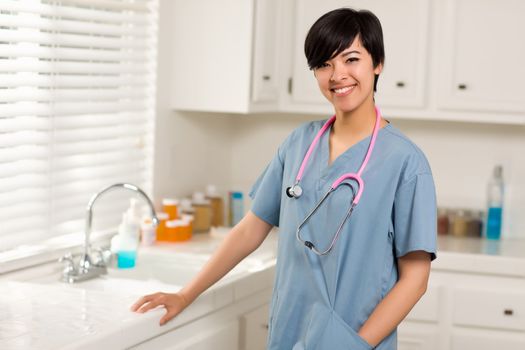 Smiling Attractive Mixed Race Doctor or Nurse in An Office or Laboratory Setting.