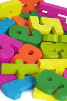 Pile of child toy wooden color letters