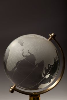 Crystal glass globe on gradient gray background