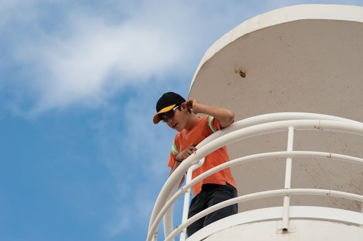 Lifeguard on duty on a beach watchtower