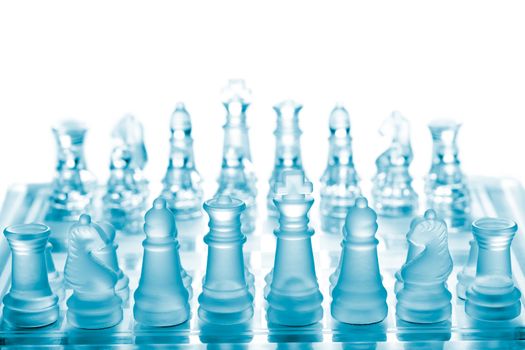 Glass chess on chessboard