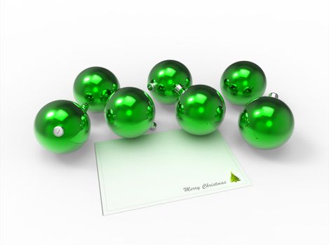 Christmas green baubles and white christmas card for the wishes
