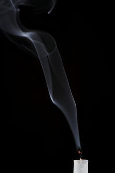 Detail of a wax candle and smoke