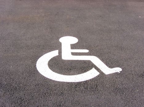 the symbol handicapped on a parking space