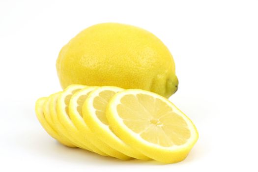 whole lemon and slices on white background 