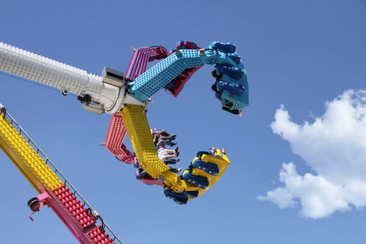 amusement park ride against blue sky