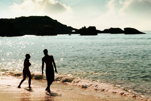 couple on a beach at sunset