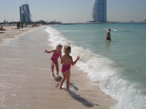 girls playing on the beach of Dubai