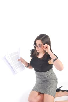 Business woman kneeling reading papers