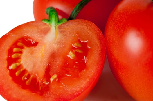 Red tomato isolated on white. Fresh red tomato. Sweet  vegetable.