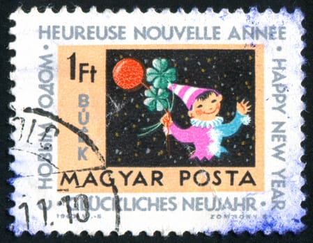 HUNGARY - CIRCA 1963: stamp printed by Hungary, shows boy, clover and balloon, circa 1963