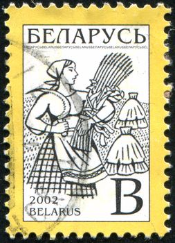 BELARUS - CIRCA 2002: stamp printed by Belarus, shows peasant woman, circa 2002.