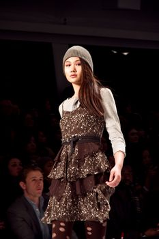 NEW YORK, NY - FEBRUARY 12: A model walks the runway at the Charlotte Ronson Fall 2011 fashion show during Mercedes-Benz Fashion Week at Lincoln Center on February 12, 2011 in New York City. (Photo by Diana Beato)