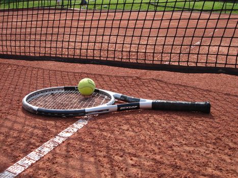 tennis ball and  racket