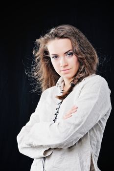 Cute young woman. Isolated on black background.