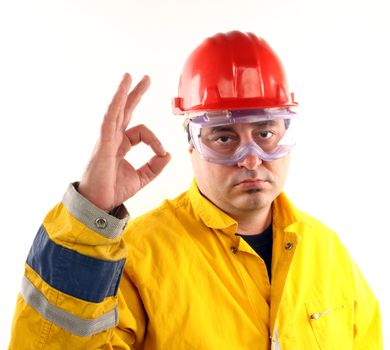 Worker with protective gear showing OK sign 