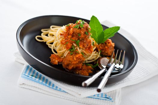 Original Italian spaghetti with meatballs in tomato sauce