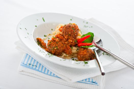 Original Italian spaghetti with meatballs in tomato sauce