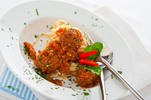 Original Italian spaghetti with meatballs in tomato sauce