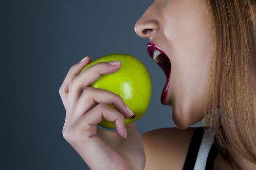 Sexual model with an apple in a hand