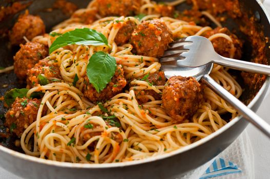 Original Italian spaghetti with meatballs in tomato sauce