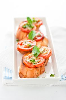 Bruschetta - gold baked baguette with tomato garlic and basil as appetizer