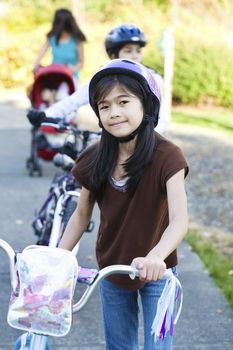 Children with their bikes outdoors