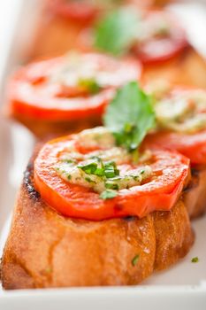 Bruschetta - gold baked baguette with tomato garlic and basil as appetizer