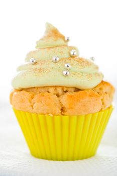 Christmas tree cupcake with gold powder and decoration