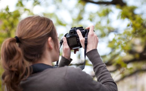 pretty female photographer outdoors