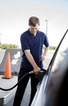 Man pumping gasoline