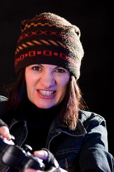 woman gamer with joystick  on darken background