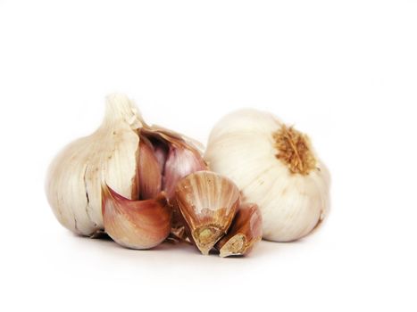 Clove of garlic, with garlics on the background