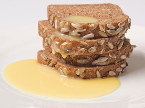 close up of brown bread with condensed milk