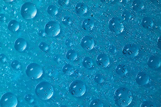 drops of water on blue background