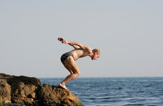 Man jumping into the sea