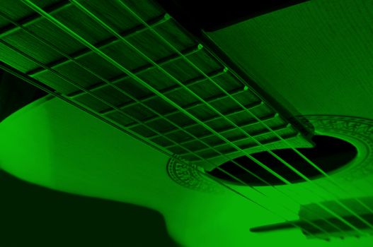 Acoustic guitar with extreme green light effect.